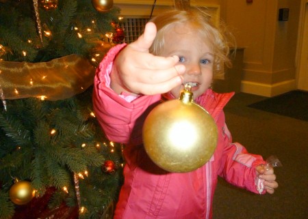 Playing with ornaments at the Lake Hart Christmas party.