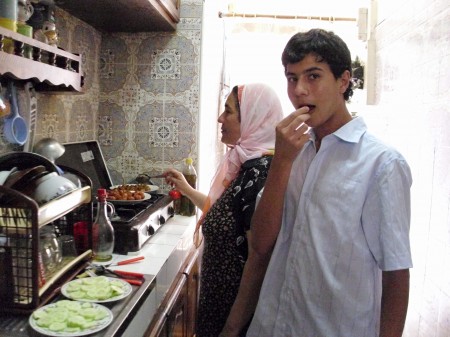 I love this picture. A friend took it to represent home. Teenage boys all over the world sneak food while their mom is cooking.