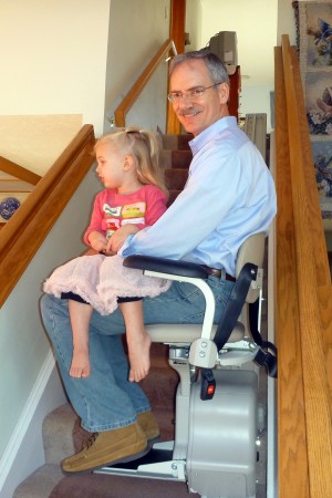 Riding the stair chair at Great-grandma and Great-grandpa.