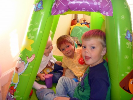 Lexi, Josiah and Brennan playing in Annada's ball tent.