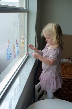 It is Annada's job to decorate our windows and mirrors.
