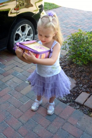 Showing off her lunch box before her test day at Montessori. 